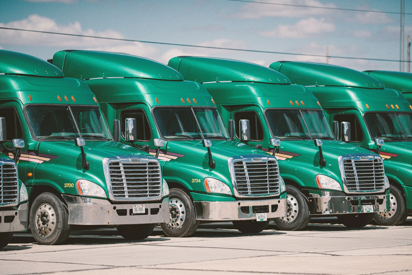 green and white vintage Commercial Auto Insurance truck